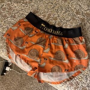 ChicknLegs Orange Snail Print Shorts